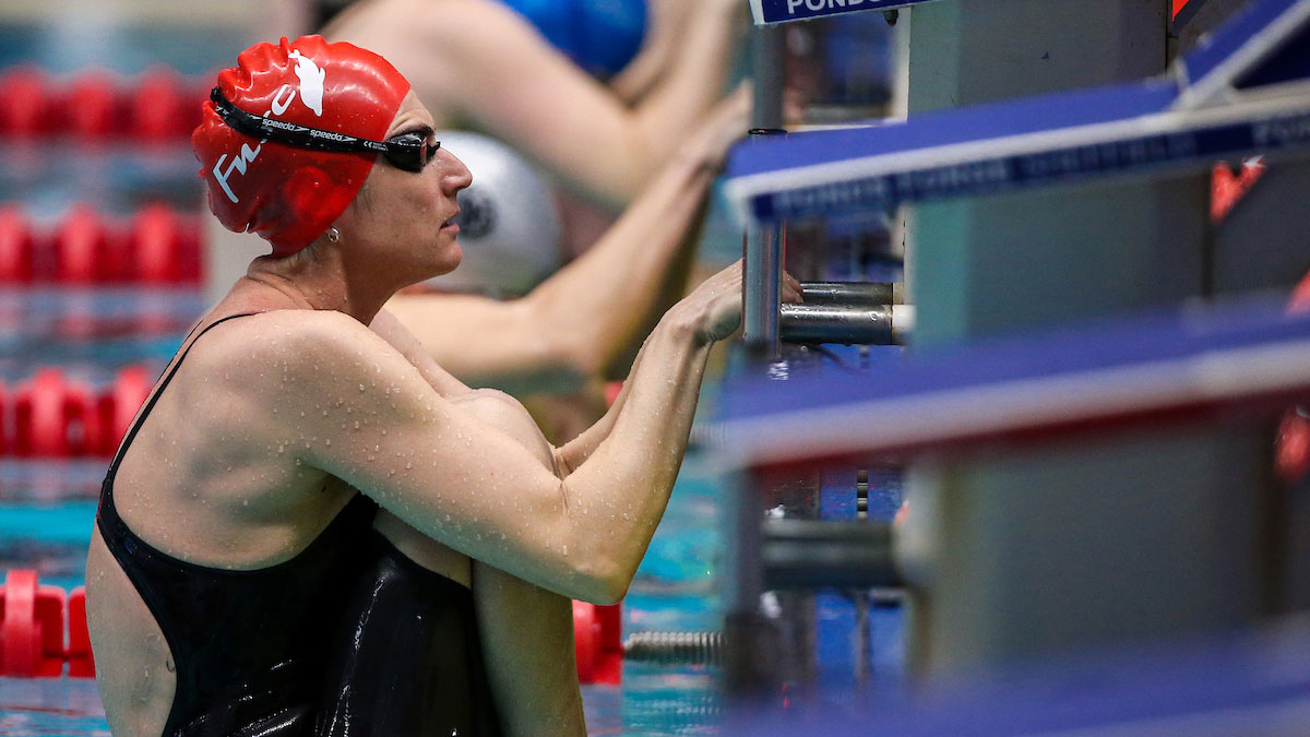 Masters swimmer Jo Corben making a backstroke start