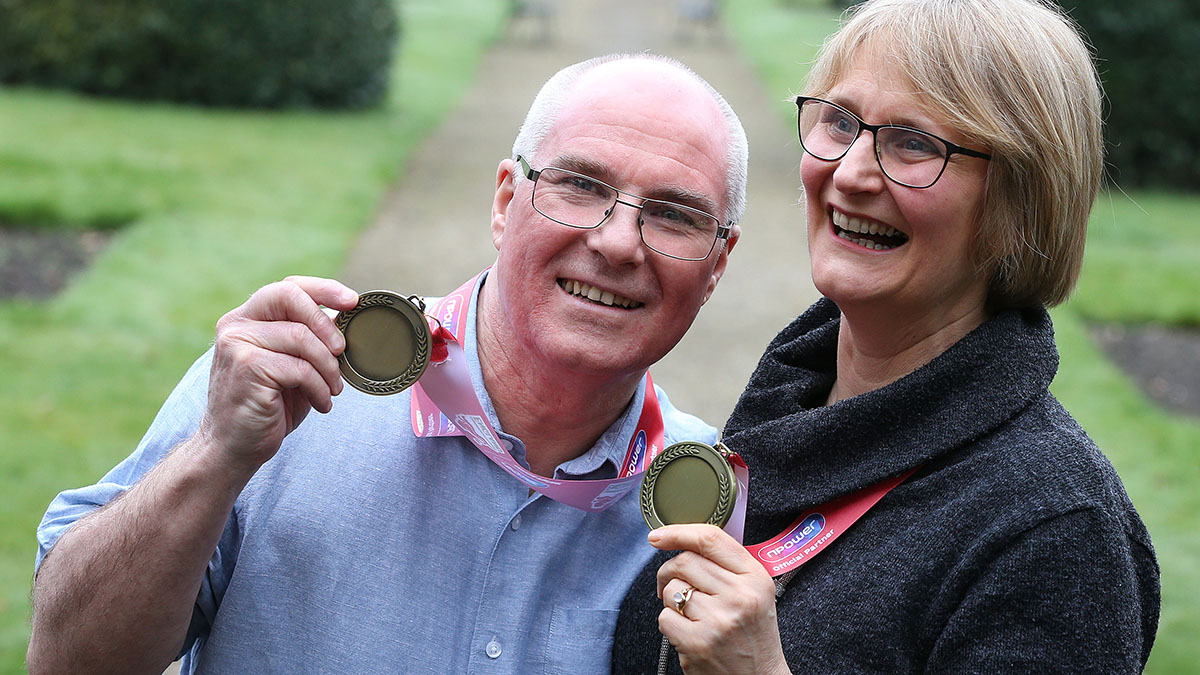 Jackie and David Laugher with medals of recognition