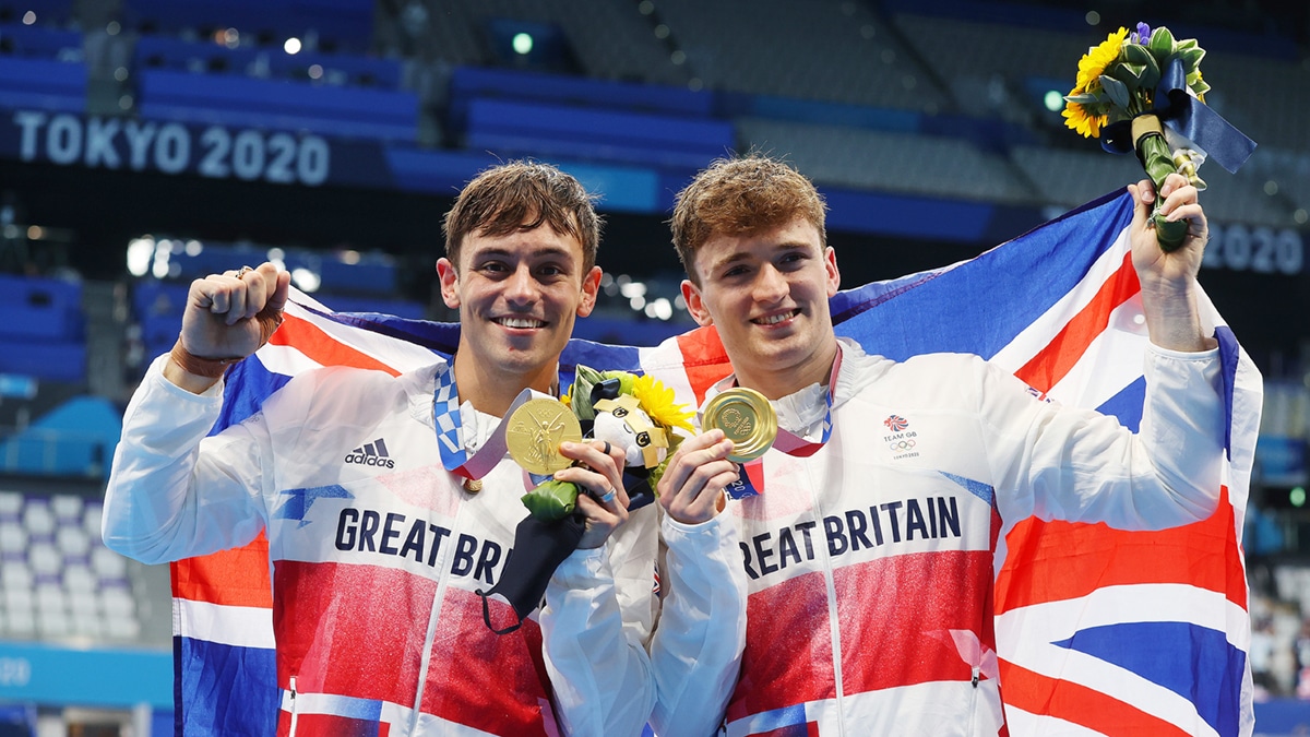 Tom Daley and Matty Lee with their gold medals after winning the Mens Synchronised 10m Platform at the Tokyo 2020 Olympic Games